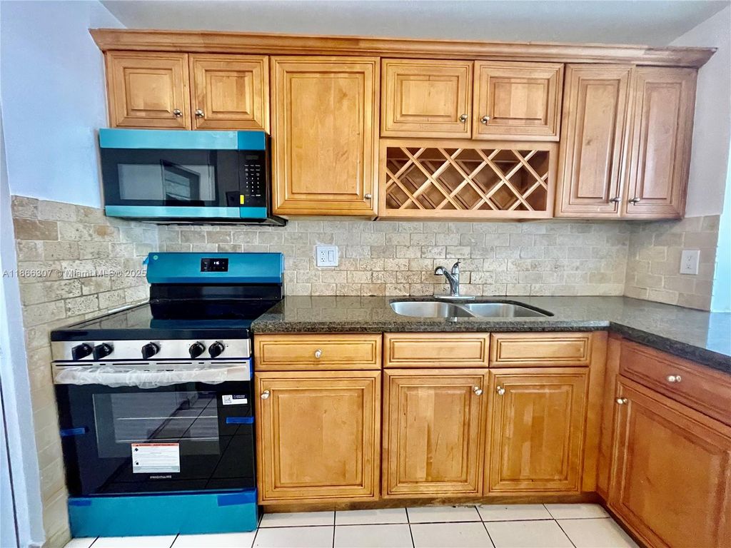 Photo of 2320 S Cypress Bend Dr #305, Pompano Beach, FL 33069 (MLS # A11866307)