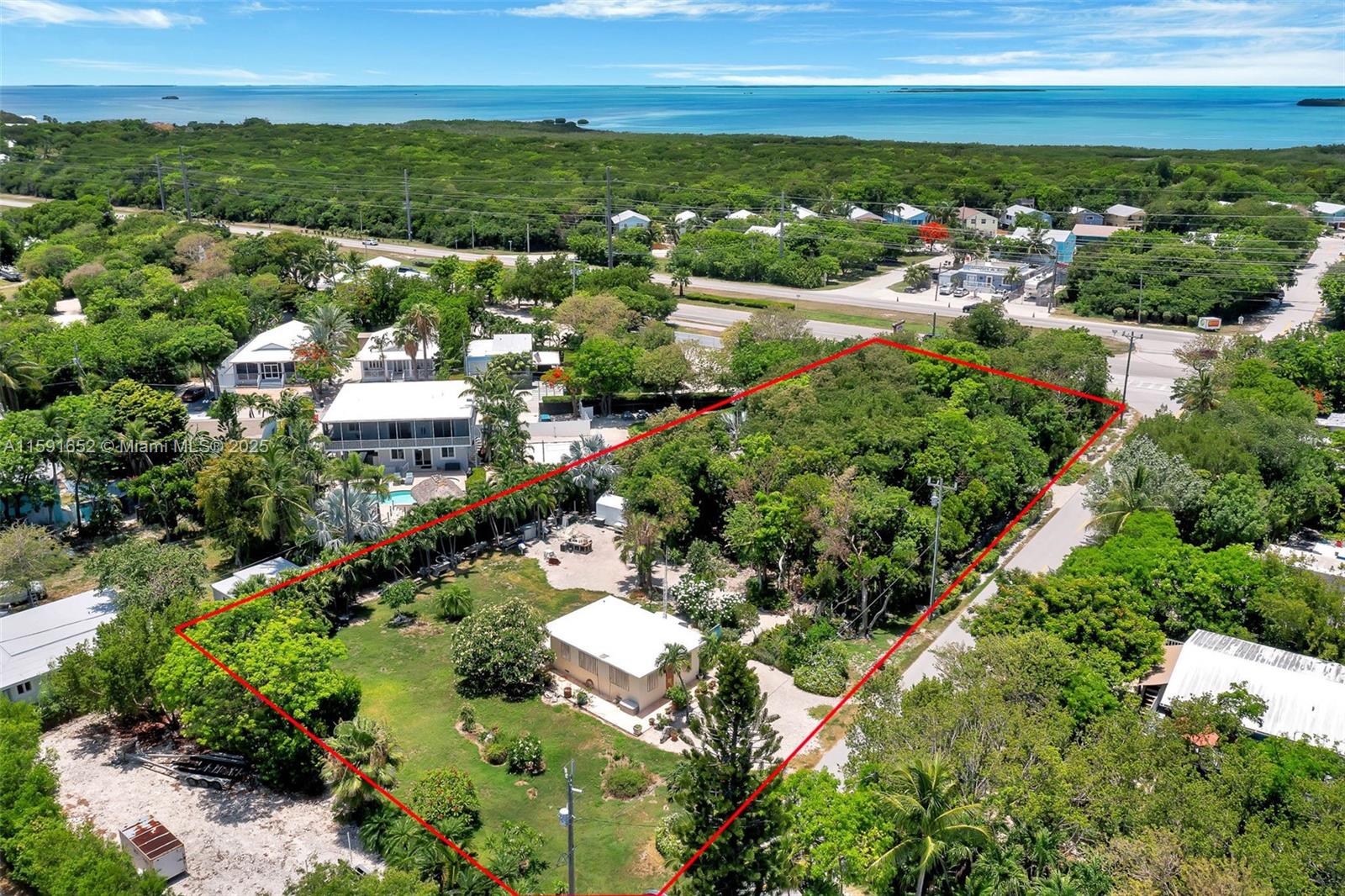 ACRE OF LAND FOR REDEVELOPMENT. Perfect for a developer or family compound. This portfolio consists of 6 lots, combining for nearly an acre (43,369 SF), including a 1948 concrete Keys cottage. Priced with the home and the adjacent lots, this property offers ocean views from the yard. The buyer is responsible for completing any necessary review processes and confirming all information regarding land use, permitting, exemptions, and development. Additional information to be verified by the buyer: The property is zoned in the IMPROVED SUDIVISION (IS) ZONING District with an allocated density of one dwelling unit per platted lot, and multiple lots may not require ROGO Exemption. Parts of some lots may be located in Hammock and Species Focus Protected Areas that require additional reviews.