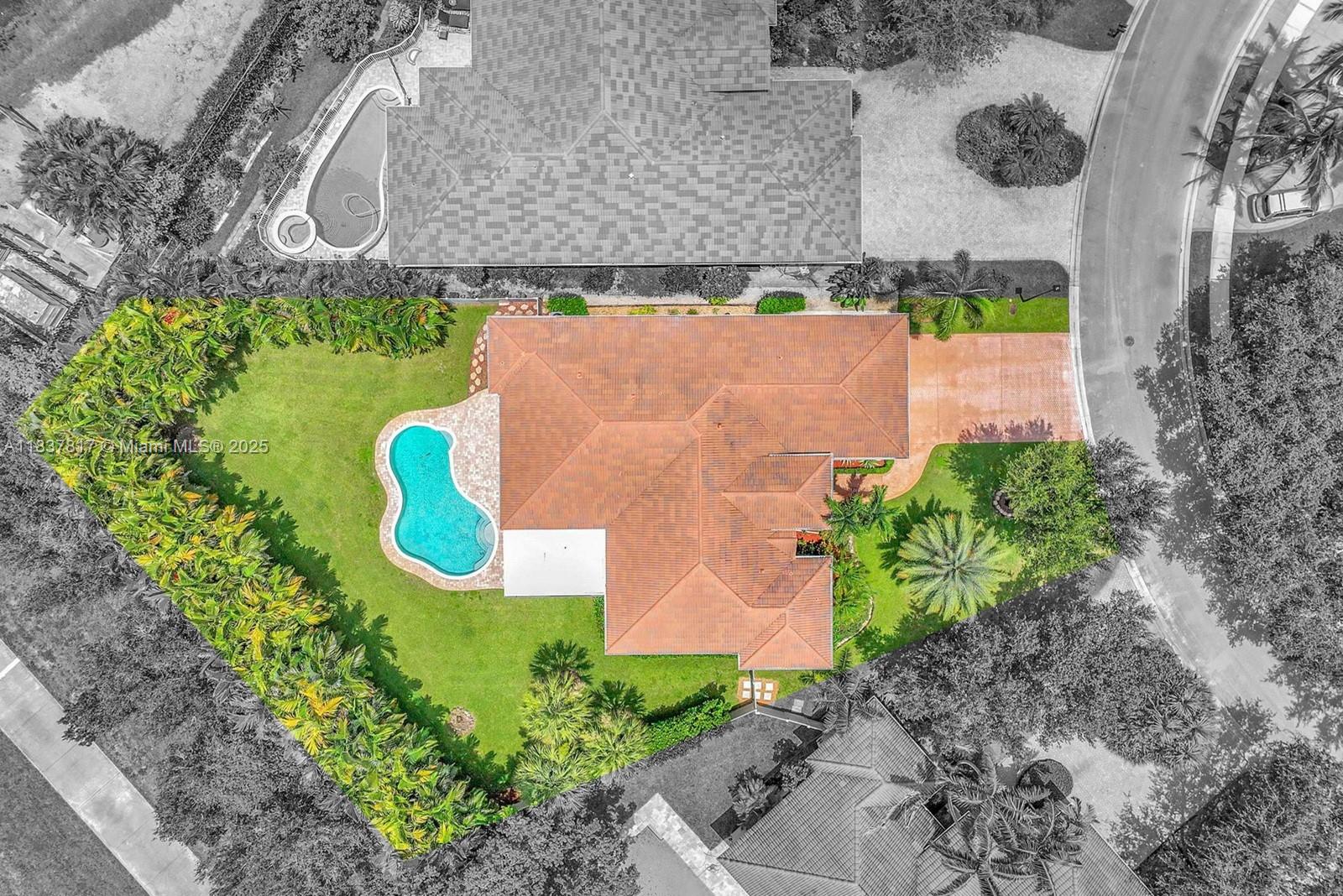 Welcome to this incredible oasis in the heart of Plantation at the Lagos Estates community! This immaculately maintained 5 bed, 3 bath home is situated on a premium, expansive 15,160 sq ft fenced lot in a gated community with only 18 homes. Spacious home with 2,592 sq ft offering an exceptional experience with a triple split bedroom plan, open kitchen counter-height seating, flowing areas for entertaining w living, family & dining rooms, brand new remodeled cabana bathroom, pretty wood-like flooring in all bedrooms, high ceilings, plantation shutters in living room & tinted windows throughout for added comfort. Spectacular outdoor space with sparkling pool, covered patio and mature landscaping. Additional features: newer A/C system & water heater, accordion shutters & gutters. Low HOA fee.