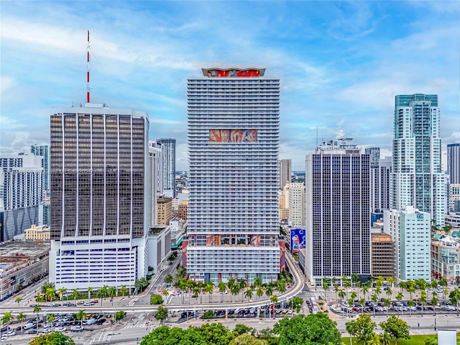 Live in the heart of Downtown Miami in this spacious 2BR + Den, 2BA condo at 50 Biscayne. Located on the 31st floor, this 1,322 SF residence offers a split layout with two primary suites, walk-in closets, tile floors, and a modern kitchen with stainless steel appliances. Enjoy the convenience of an in-unit washer/dryer. Rent includes water, internet, streaming services, garbage, and 1 assigned parking. Building amenities feature 24/7 concierge, valet, infinity pool, fitness center, spa, clubrooms, and EV charging stations. Steps from Bayfront Park, Kaseya Center, Whole Foods, and Metromover. Available Nov 1.