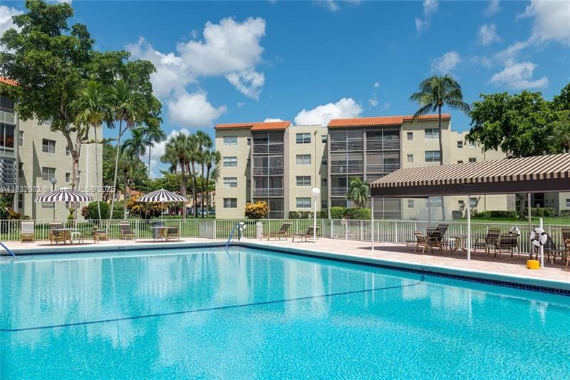 Renovated Corner First Floor unit. Spacious and full of light. Freshly painted. Porcelain floors in living areas and wood laminate in bedrooms. Lake view. Gated community with swimming pool and recreation area, gym , billiards room etc.