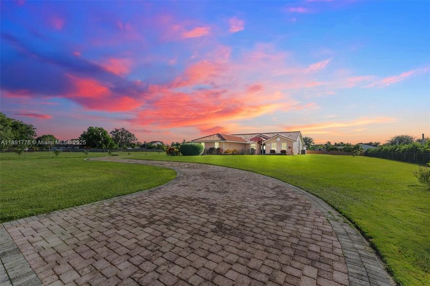 Uniquely beautiful and tranquil, this 4-bed, 3-bath home sits on a 1.25-acre lot with a concrete privacy wall and electric gate. Built with care in 2006 and kept in pristine condition, it features soaring vaulted ceilings, a split floor plan, and a combined laundry/pantry room. Brand-new kitchen appliances and a new A/C unit add modern comfort. A detached garage/workshop fits up to 6 cars. With more land than neighbors, there’s space to add a pool, garden, or anything you envision. Between both garages, you’ve got room for cars, tools, and big ideas. And with plenty of garden space and more than enough room for a pool, you can truly live the way you've always wanted. It's a must see! The property is equipped with solar panels from Sonaova Company, the buyer must assume the existing lease.