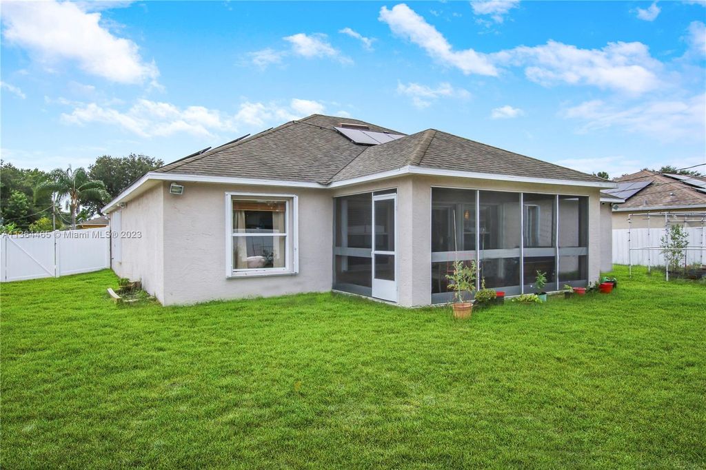 Photo of 1931 SW Aguero St, Port Saint Lucie, FL 34953 (MLS # A11364465)