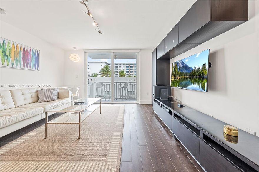 Beautifully updated 1-bedroom, 1-bath residence with a versatile den that can easily be used as a second bedroom, office, or guest space, located in the highly desirable South of Fifth neighborhood. This modern unit features an open-concept layout, sleek kitchen with high-gloss cabinetry, stainless steel appliances, and a spacious island ideal for entertaining. Wood-look ceramic tile flooring flows throughout, creating a warm and contemporary feel. Bedrooms offer custom-built closets maximizing storage and functionality. Spa-inspired bathroom with glass-enclosed shower and designer finishes. Enjoy ocean breezes and ocean views from your private balcony just steps from the beach. Includes an assigned parking space, a rare and valuable feature in the area, with the option to sell the space separately if not needed, for up to $50,000. Prime location near world-class dining, parks, and the Miami Beach boardwalk. Turnkey and move-in ready.