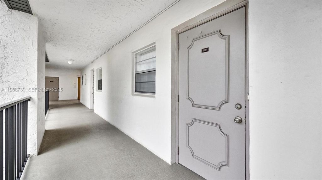 Photo of 9460 Poinciana Pl #404, Davie, FL 33324 (MLS # A11958739)