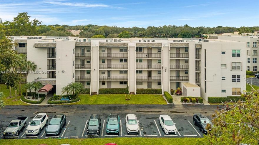 Amazing Price-Point for quick sale!*Beautiful condo in ~Premier Pine Island Ridge Country Club~Charming*Lake view~4th floor condo w/Tile in living areas, Carpeted BRs, & a screened balcony overlooking views of the lake & green space~Pristine, pet-free home w/ water, cable, sewer & refuse, pest control incl**Internet coming in May 2026!~Community Washer & Dryer in close proximity of the unit~Includes 1 assigned parking space and plenty of guest parking~Enjoy resort amenities: private Poinciana pool and a Grand C.C. pool, fitness ctr, 3 card rooms & 2 on-site restaurants, Pickle ball,Tennis, Bocci Ball, Pro shop w/golf prices for members and their guests, Centrally located w/ easy access to major hwys, top schools, shopping & dining. True maintenance-free country club living~Priced to sell!* ideal opportunity for first-time buyers & downsizers or just looking to have a seasonal snow-bird lifestyle this is a turnkey property in one of Davie’s most desirable neighborhoods.~No Leasing *Minimum credit score 650~Pets under 20lb ok~