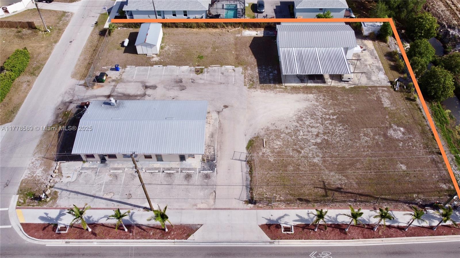 This is the opportunity you've been waiting for you! Almost an acre of land on W. Terry St with 200 feet of linear frontage, next to the new round-a-bout in the heart of Bonita Springs. 10401 W. Terry is currently a restaurant, Mayan, on a month to month lease paying $1950/month. Also on property is 10411 W. Terry, now a vacant auto repair shop. The lot is 30,000 SF/.69 acre and The property is located within Bonita Spring's Old US 41 Corridor Redevelopment Masterplan. The redevelopment zoning is 3A allowing you many future uses and possible tax incentives. There is approximately 200 linear feet facing W. Terry St and fully fenced in. Walk to Riverside Park!
