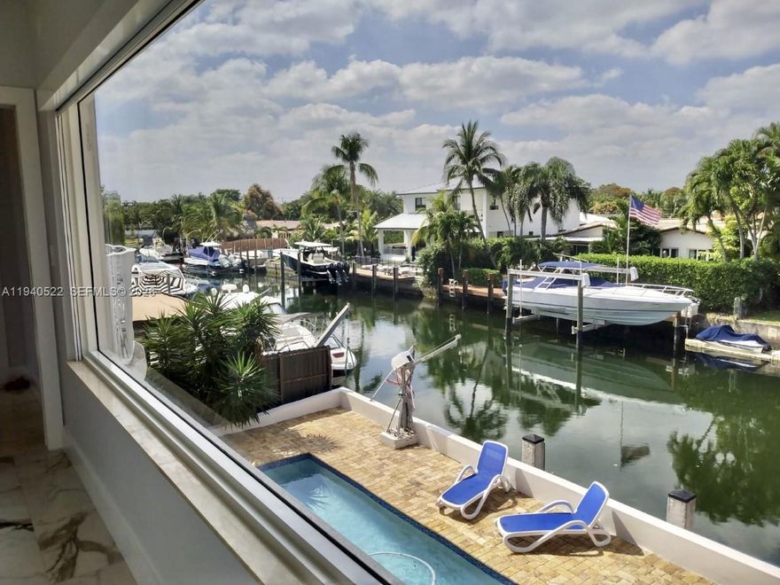 Spectacular Waterfront corner Home on desirable Keystone Island with pool. 4 bedrooms and 3 bathrooms. First floor it has living area, dining area, kitchen, 3 bedrooms and 2 bathrooms. Second floor is the entire master bedroom with full privacy. The property has 90 feet on the water with access to Biscayne Bay, boaters dream. It could be furnished or unfurnished. Price is firm!