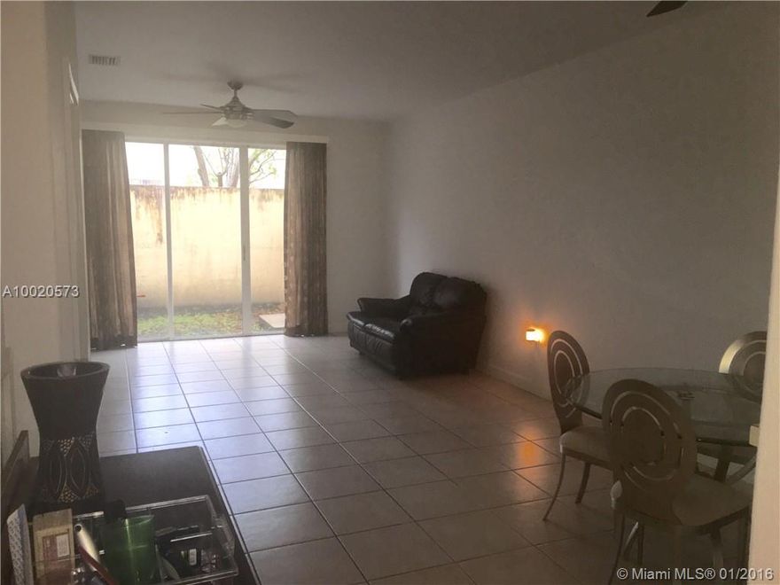 HUGE REDUCTION to lowest price in Doral for huge townhome. Owner extremely motivated. Location location location! Located in the center of DORAL.  Rarely available huge 2 bedroom, 2 and 1/2 bath, townhouse in great community. Upgraded flooring, large patio, furniture included, huge 60" flat screen tv, great investment opportunity or home. AAA + rated Schools, fantastic neighborhood offering great restaurants, shopping, a new downtown, beautiful parks, outdoor and indoor recreation, and much much more!