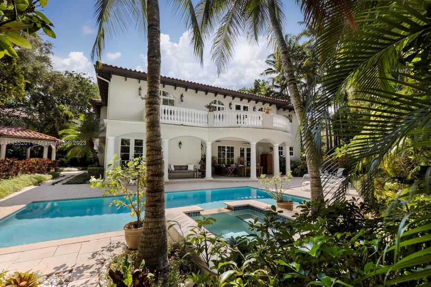 Walk or bike to the Grove village center’s galleries, boutiques, cafes & bayfront parks from this stunning home on a secluded, tree canopied cul-de-sac. European-style architecture combined w/ modern features & high-end finishes create a one-of-a-kind residence. Impressive foyer entrance w/double height ceilings, leads to light-filled formal living/dining, large family room & music room w/vaulted, wood-beamed ceilings. Expansive eat-in kitchen offers a center-island & Viking appliances, including a commercial-quality gas range. Luxurious primary suite features 11’ x 18’ custom walk-in closet + 335 SF open terrace overlooking the tree-tops. 24/7 neighborhood security patrol. An ultra-private, lush tropical garden surrounds the tranquil pool & captivating gazebo with full outdoor kitchen.