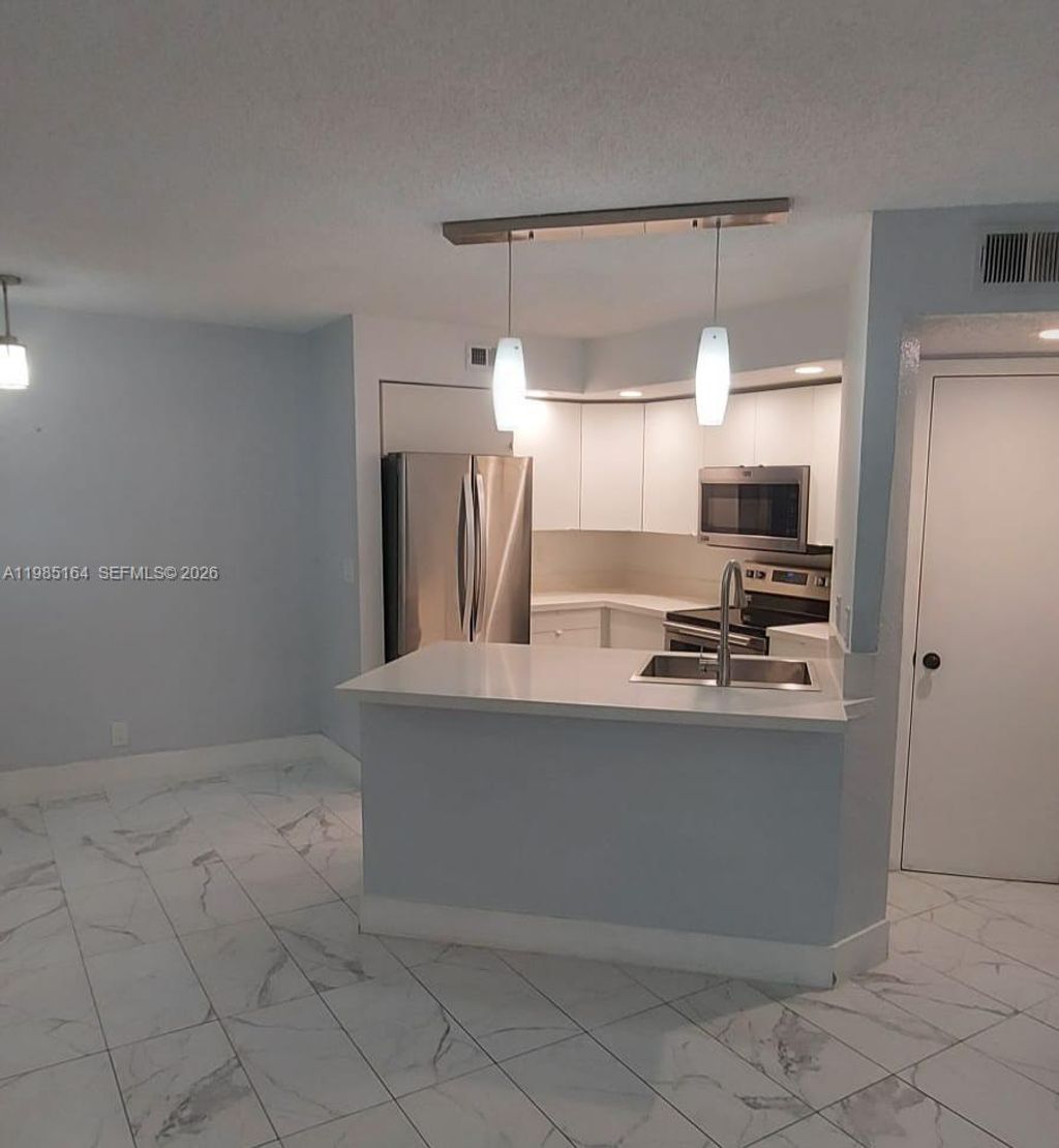 Photo of 731 Vista Isles Dr #1511, Sunrise, FL 33325 (MLS # A11985164)