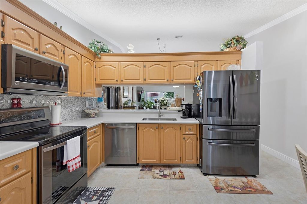 Photo of 5109 NW 11th Way, Deerfield Beach, FL 33064 (MLS # A11832645)