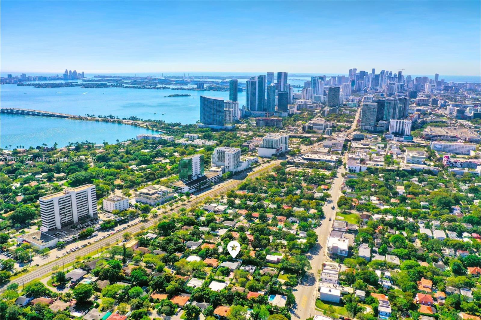 Just Blocks From the Vibrant Miami Design District, This Updated 3-Bed, 2-Bath Home Offers a Rare Blend of Style, Comfort, and Opportunity. Nestled on a 7,000 Sq Ft Lot, It Features a Gated Driveway, New Roof (2022) and A/C, Impact Windows and Doors, and a South-Facing Yard With Lush Fruit Trees and Ample Space to Add a Large Pool. Inside, You'll Find 1,700 Sq Ft of Light-Flooded Living Space and a Third Bedroom With Potential for a Private Efficiency—Perfect for Additional Income. This Property Is Ideal for a High-Return Renovation. Surrounded by Top-Rated Schools and World-Class Shopping and Dining, This Home Is a Quiet Oasis Tucked in the Heart of Dynamic Miami—Offering an Incredible Lifestyle and a Smart Investment.