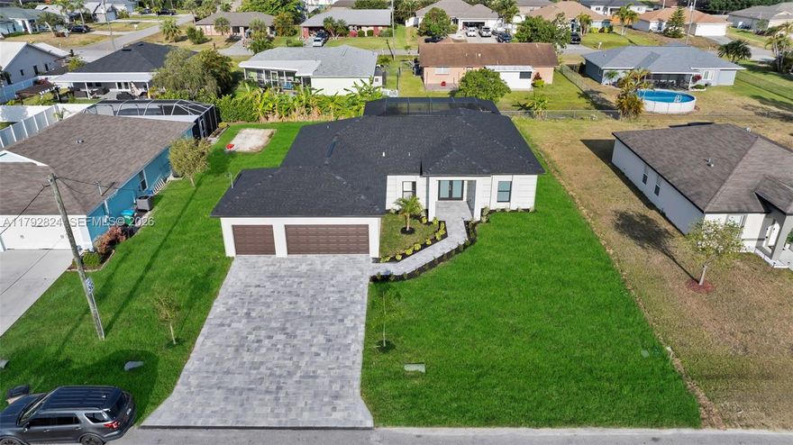 Location! This brand-new pool home is ideally located in the heart of town, tucked between Skyline and Santa Barbara, placing you just minutes from great restaurants, shopping, and Lake Kennedy Community Park. The home features a spacious 14' x 28' pool with a sundeck and a fully screened-in lanai, perfect for enjoying the Florida lifestyle year-round. Inside, you'll find soaring vaulted ceilings, 8' interior doors, and stunning 24" x 48" tile flooring throughout. The kitchen and living spaces are designed with an abundance of cabinetry, offering both style and functionality. Built with hurricane-impact windows for added security and peace of mind, the home also includes a paver driveway, a generous 3-car garage, and is connected to city water and sewer with all assessments fully paid.