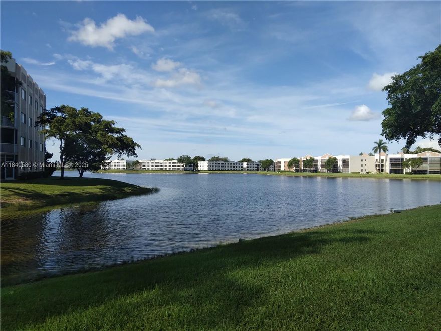 A spacious 2/2 unit in the popular SOUTHAMPTON - KINGS POINT 55+ community!  24-hr gated community.  Well maintained & tiled throughout.   Relax & enjoy the picturesque water view!  Front & back patios; back patio overlooking water is screened & glass (plexiglass) enclosed; front patio has garden off to the side.  Full size washer & dryer for your convenience. Parking space is conveniently located in front of the unit.  Community offers an array of activities to enjoy daily, including a fitness center, indoor & outdoor pools, tennis, & more.  A theater presents a variety of entertainment.  Close to major highways, restaurants, & shopping.