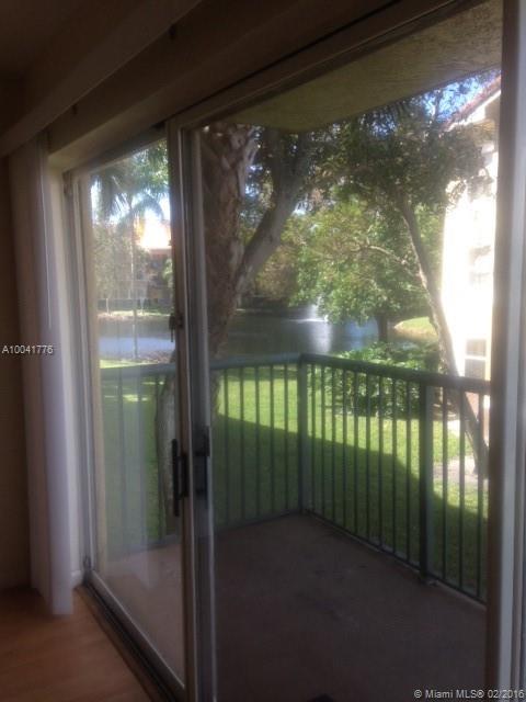 apartment is ready and well maintain. Warm colors tons of space. wood floors in the main area and hall/ carpet in the bedrooms. Water views from the LR, Balcony and MBR. MBR has walk in closet and bath. Enjoy this open layout light and bright. Cabinets are rich cherry with white granite tops/Eat in kitchen with water views. Full Laundry room too. Resort Style Pool and Amenities.