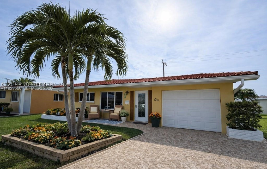 Photo of 4208 NW 47th Ct, Tamarac, FL 33319 (MLS # A12073470)