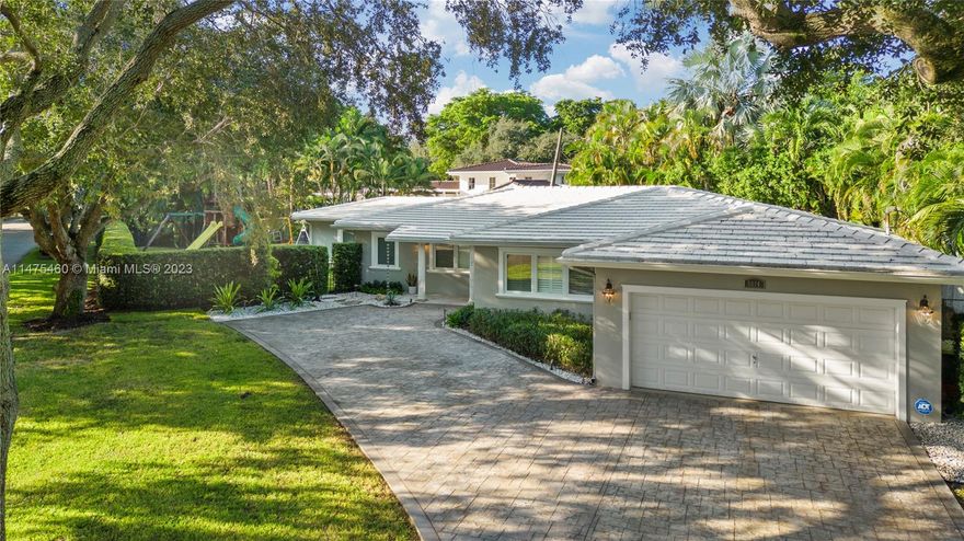 NEW PRICE!!! Remodeled by Hollub Homes with keen attention to detail. Prime South Gables location on a quiet oak lined street. Bright and open floor plan with split bedroom design featuring impact windows throughout, plantation shutters, custom wood molding, and marble floors. Luxurious master walk-in shower, fully remodeled bathrooms, and wainscoting in bedrooms. French doors lead to outdoor summer kitchen overlooking beautifully fenced yard with custom lighting, high privacy hedge, and fresh landscaping. Functional double car garage with built-in storage. 2017 roof. This home is truly turnkey. Exclusions: light fixtures in main bedroom and purple bedroom.