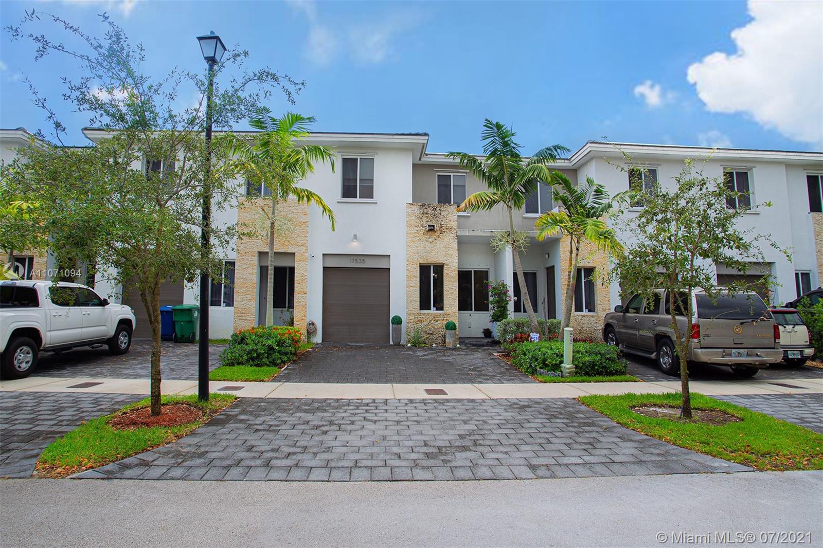 Sensational two-story townhouse fitted with 3 bed & 2 1/2 baths. Remarkably this home is less than 5 years old & comes with all the modern touches of new construction. This spacious home is dressed with gray hardwood floors & tile in the bathrooms. Upon entry is a sizable foyer area that allows for creativity. Make your way to the eat in kitchen next to the family room. Complementing this space is a large patio with space to enjoy. Half bath & 1 car garage round out the 1st floor. Make your way upstairs to a personal laundry room. Master bedroom has access to a balcony, walk-in closet & the master bathroom has dual vanity sinks, large shower & roman tub. 2 guestrooms are also upstairs, one with direct entry to the 2nd full bath which also features dual vanity sinks. This home is still new!
