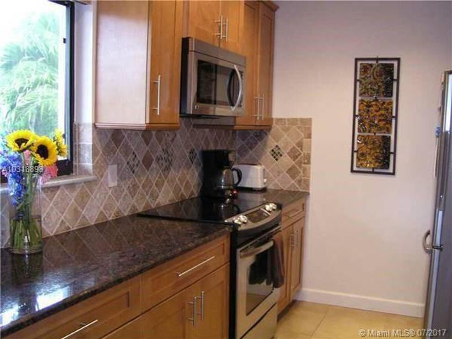 2 Bedroom 2 Bath 2nd Floor Condo, Updated kitchen with granite countertops and stainless steel appliances, washer, dryer, wood floors in living area, both bathrooms all updated, screened porch overlooking garden area, no pets per association, all age community, community pool. Water included in rent. First, last and security.