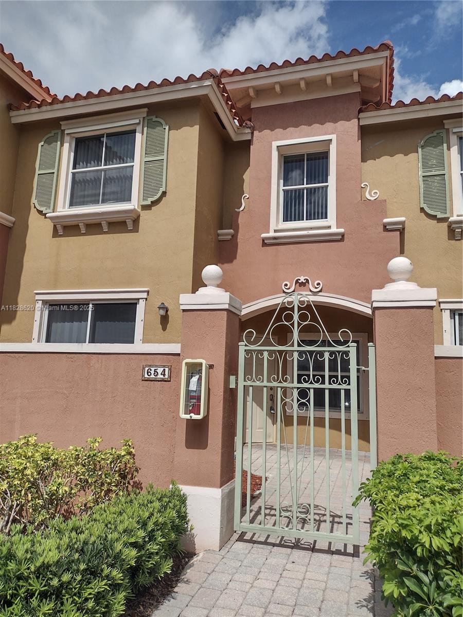 Beautiful 3/2.5 townhome located in the guard-gated community of Hampton Isles. Near Pembroke Lakes Mall, City Center, restaurants, shopping, and parks. The home has been freshly painted, and the kitchen features granite countertops and newer stainless steel appliances. Ceramic tile downstairs, and laminate flooring upstairs. There is a private courtyard entryway, and a second patio as well. There are two assigned parking spaces, and a community pool within walking distance. Best location and best value in Pembroke Pines!