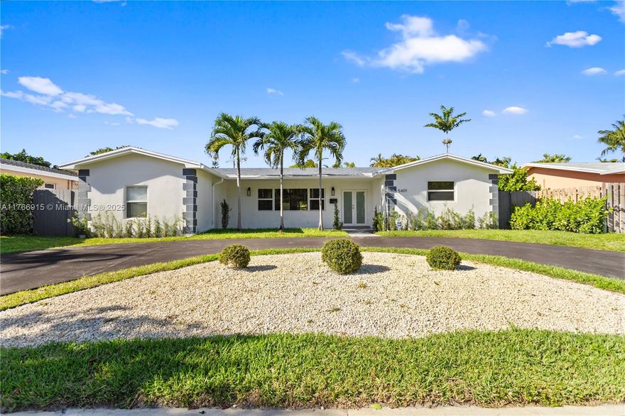 This newly renovated 4-bed, 4 bath home sits on a 9,311 sqft lot and exhibits no-expense-spared craftsmanship and design. The open floor plan features new floors, and a gourmet kitchen with imported quartz and top-tier appliances. Luxury bathrooms include custom cabinetry, rainfall showers, dual sinks, and a makeup vanity. An extra-large walk-in closet in the master suite. The separate in-law suite offers privacy with its own kitchen and bathroom. A circular driveway provides parking, while the backyard features a pergola, new landscaping, and a sprinkler system ideal for relaxation and entertaining. Additional features like impact windows, modern electrical and plumbing systems, an electric water heater, and designer lighting fixtures, make this home a true gem in the Hollywood hills.