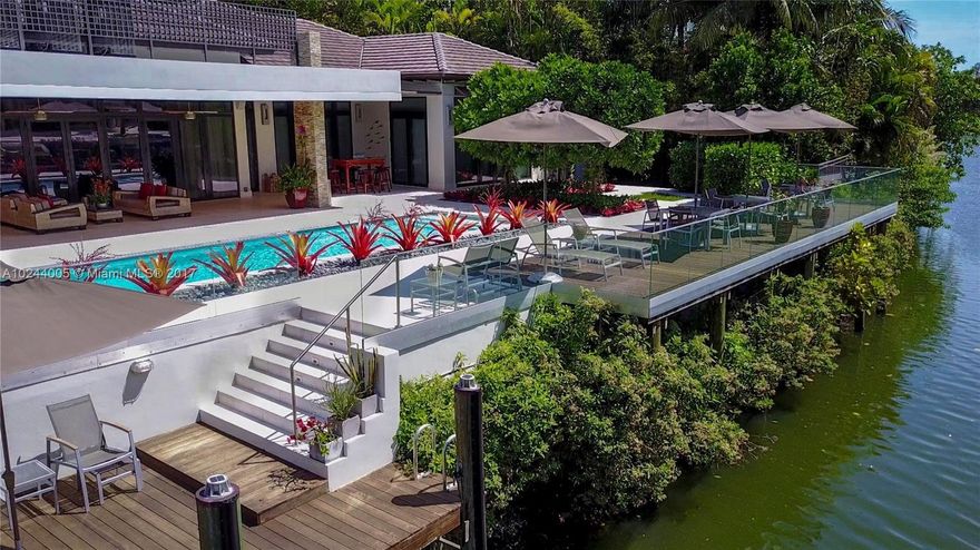 NEW CONSTRUCTION Built 2014.  Modern, ultra-luxury,  waterfront home in Coral Gables is the perfect expression of the highest quality. Features 5 BED, 5 BA and 2 half BA, 2 car gar plus room for 2 on lift, high ceilings, Impact windows & Doors, Marble, LED lighting, Smart Technology control systems, safe room,  heated pool and spa, cantilever deck over water, indoor and outside BBQ/Bar area.  Home designed by Award winning Architect & collaboration of renowned designers. See attached document for extensive feature list.