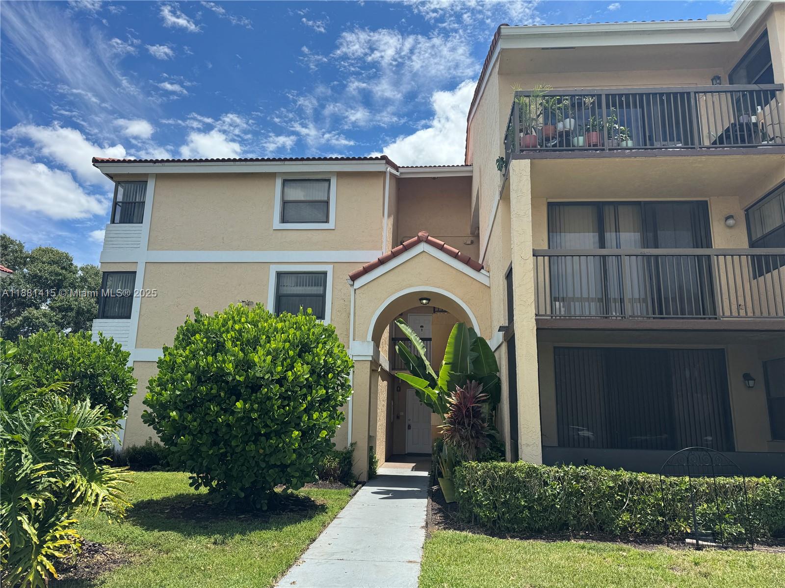 Rare Corner Ground Floor 2/2 Apt in the desirable Grand Oasis at Coral Springs. Located in a prime area close to shopping, dining options, and top-rated schools. Inside, you'll find a cozy and clean space with split layout, good size bedrooms and ample kitchen, all tile in the living-dining area and new laminate floors, stackable washer & dryer inside. The bedrooms are comfortable and offers a relaxing retreat after a long day. Great common areas perfect for entertaining or relaxing. The unit is situated on the ground floor, making it easily accessible. Enjoy a nice view and open balcony. Water and sewer are included, 2 assigned parking and guest spots throughout. OK To Lease Right Away. Don't miss out on the opportunity to make this apt your new home. Schedule a viewing today!