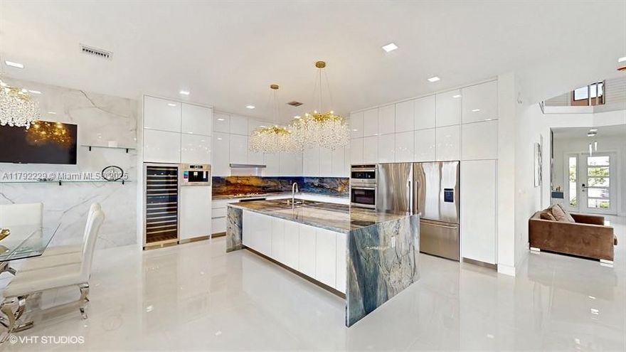 Welcome to this stunning luxury Polynesia model in Lotus Palm. Fully renovated and move-in ready, this exquisite 7-bedroom, 5-bathroom lakefront home in Lotus Palm community offers over $500,000 in upgrades and breathtaking LAKE VIEWS. Optional pool. Bright open floor plan, gourmet kitchen with quartz countertops, premium appliances, upgraded marble tiles, wood floor upstairs, a striking modern staircase, new electric, fireplace, etc.  Private movie theater with built in bar and drink station.  Upgraded bathrooms, hurricane-impact windows, smart home technology, two-car garage. Resort-style amenities: pools, clubhouse, fitness center, tennis courts, pickleball, playgrounds, social lounges. Top-rated schools, fine dining, upscale shopping, major highways. VIRTUAL TOUR ATTACHED.