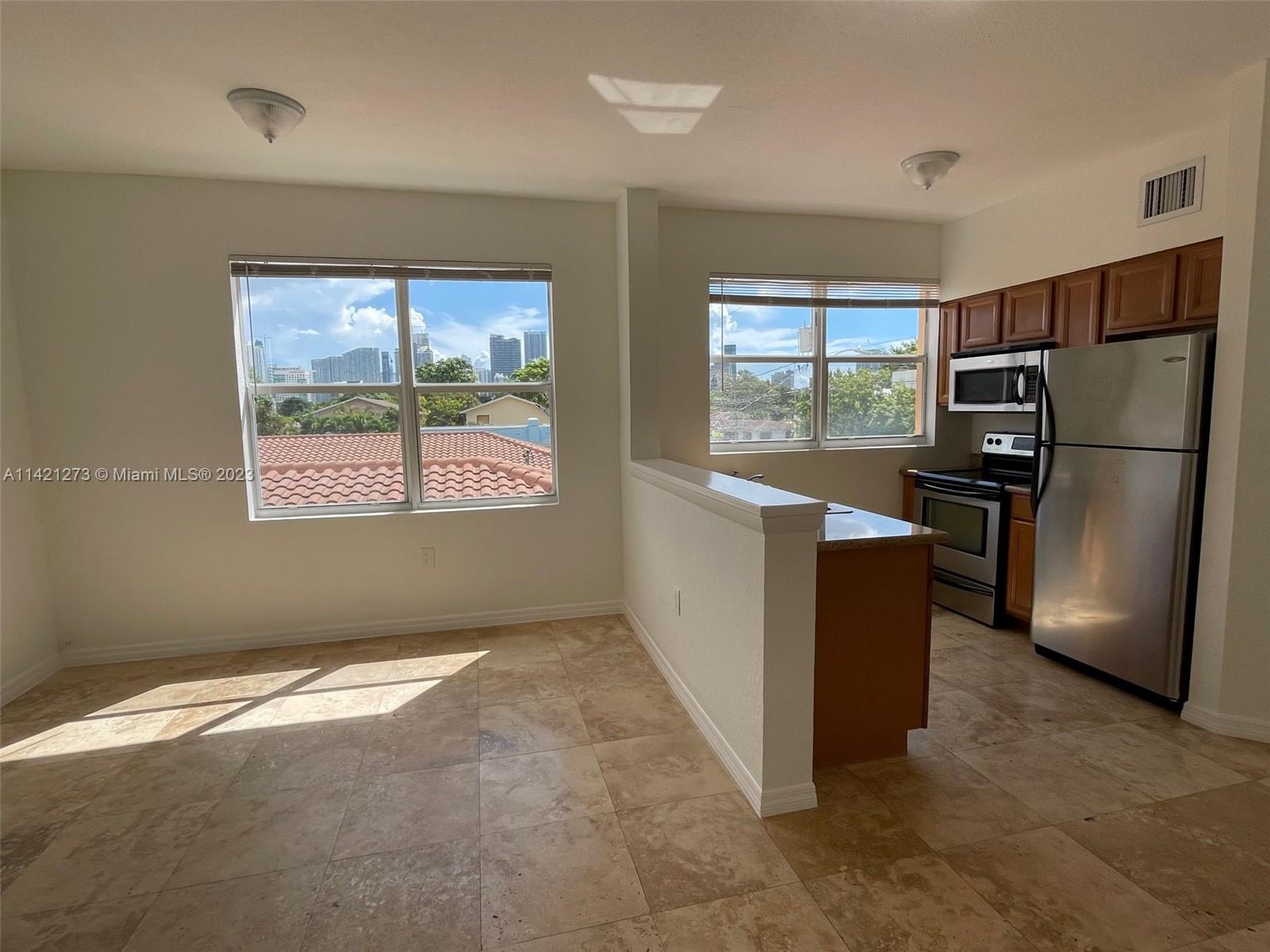 Completely Renovated Corner Unit 1/1 - Lots of sunlight. Stainless Steel kitchen appliances, open kitchen with granite counter top, Washer & Dryer within the unit. Central A/C. Wood Floors. City skyline views. Next to Brickell and Downtown.