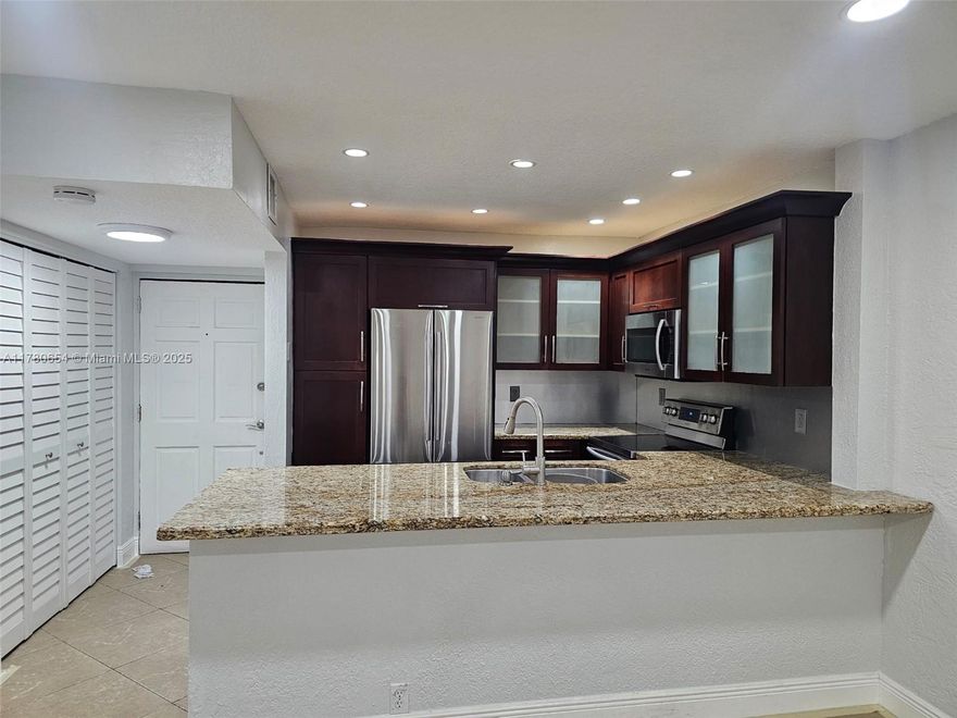 ONLY CASH!!! GORGEOUS CORNER UNIT - LOW HOA - BEAUTIFULLY RENOVATED - IMPACT WINDOWS. MOVE-IN READY, ALL AGES, THIS CONDO FEATURES 2 BEDROOMS, 1 BATHROOM, DESIRABLE KITCHEN W/ GRANITE COUNTER TOP, STAINLESS STEEL APPLIANCES, WOODEN CABINETS W/ PULL OUTS/ LAUNDRY INSIDE UNIT, CLOSETS WITH BUILTS-IN /ARMOIRES. SCREENED PORCH, STORAGE ROOM. NEWER A/C. THE COMPLEX COUNTS WITH 3 POOLS, TENNIS COURT AND THERE IS A PUBLIC PARK JUST A FEW STEPS AWAY IS CONVENIENTLY LOCATED WITH ACCESS TO MAIN ROADS. MINUTES AWAY TO SHOPPING, RESTAURANTS, HOSPITALS, PARKS AND ETC.  DO NOT MISS OUT ON THIS TREMENDOUS  OPPORTUNITY!