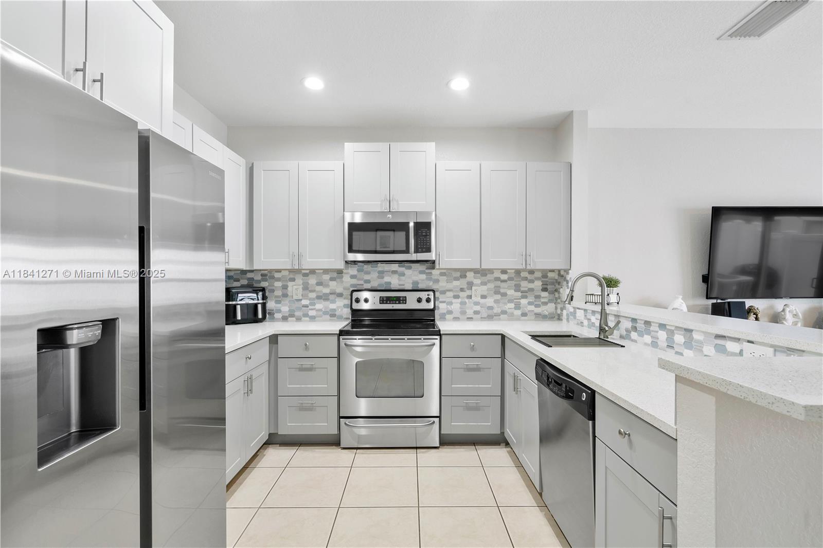 Welcome to Oakland Park—a warm and modern two-story townhouse in the community of Cambridge Park, 2 spacious bedrooms, 2.5 baths and a flexible loft perfect for a home office or guest space. This home features impact windows and stylish finishes throughout. The open-concept kitchen shines with stainless steel appliances, generous counter space and a cozy breakfast bar that flows seamlessly into the bright living room. Upstairs, the primary suite offers a peaceful retreat with a large walk-in closet and private bathroom. Also a roomy secondary bedroom with a full bathroom. One-car garage and access to community amenities including a pool and a playground. This home is just minutes from I-95, downtown Fort Lauderdale and the beach, move-in ready and full of charm. Two cars max per home.