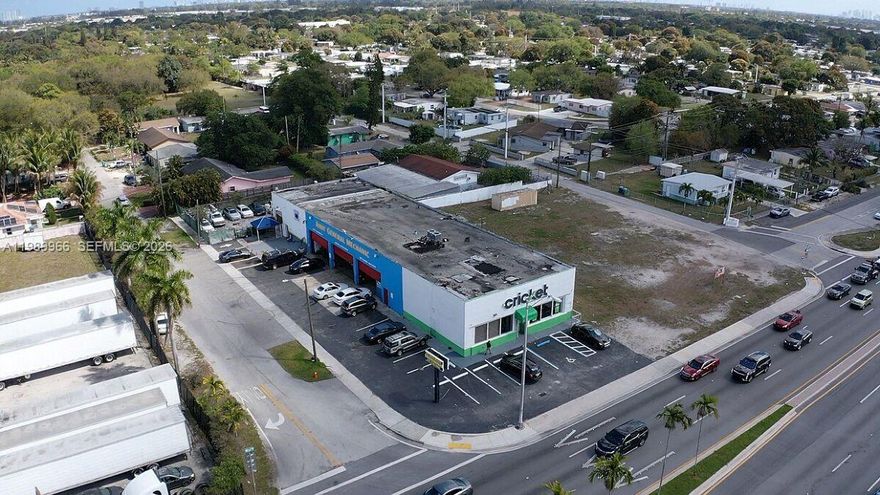 Rare high-exposure flex industrial/retail asset positioned on a signalized corner along NW 27th Ave, one of Miami-Dade’s busiest corridors with 75,000–100,000+ vehicles passing daily. This versatile property combines industrial functionality with a strong retail component, anchored by Cricket Wireless, providing immediate in-place income and tenant stability.

The 8,000 SF building sits on over 0.56 acres, offering a highly functional layout with grade-level doors, 20’ ceilings, and excess land ideal for outdoor storage, fleet use, or future expansion. The flexible configuration makes it ideal for automotive, contractor, logistics, or service-based owner-users seeking both operational efficiency and unmatched visibility.

Strategically located with immediate access to I-95 and the Florida Turnpike, and surrounded by dense residential population exceeding 500,000 within a 5-mile radius, the property benefits from strong consumer demand and consistent traffic flow.

This is a true value-add opportunity with below-market in-place income, allowing a new owner to increase rents, occupy the space, or reposition the asset to maximize returns. Opportunities to acquire a flex asset with land, exposure, and an established retail anchor tenant in this submarket are extremely limited.