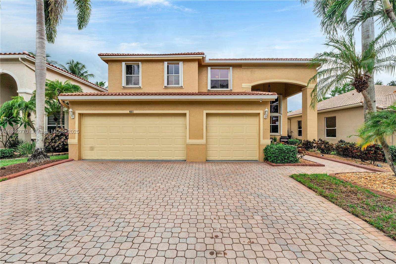 Beautifully updated 4-bedroom, 3.5-bath home with new roof, 3-car garage, private screened-in pool, in gated community. Features include an updated kitchen with granite countertops and dry bar, renovated primary bathroom, tile & hardwood flooring, NO popcorn ceilings, enjoy smooth finish and accordion shutters. Primary suite on the first floor, plus a second master upstairs—great for guests or multi-gen living. Gated community with resort-style pool, indoor gym, and 1GB fiber optic internet included. Close to Promenade Mall, shopping, dining, and the Turnpike.