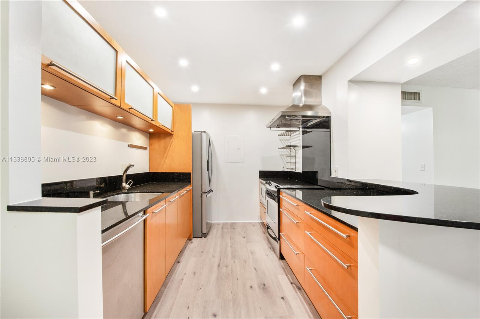 Want 2 bedrooms 2 baths in Dadeland area without paying too much? How about washer & dryer in the unit? And lots of parking too? Look no further than this impeccable unit in Kings Creek WEST. Brand new floors, freshly painted and waiting for its next owner! Recessed lighting throughout. Condo maintenance fee includes cable, exterior insurance, Fumigation, Tennis, Community pool, and on-site management office. Unit also comes with STORAGE SPACE! Plenty of parking, located on 2nd floor for added privacy. Nice balcony overlooking garden and trees. 2 blocks from Palmetto, restaurants, shopping, everything! This unit won't last, call listing agent today!