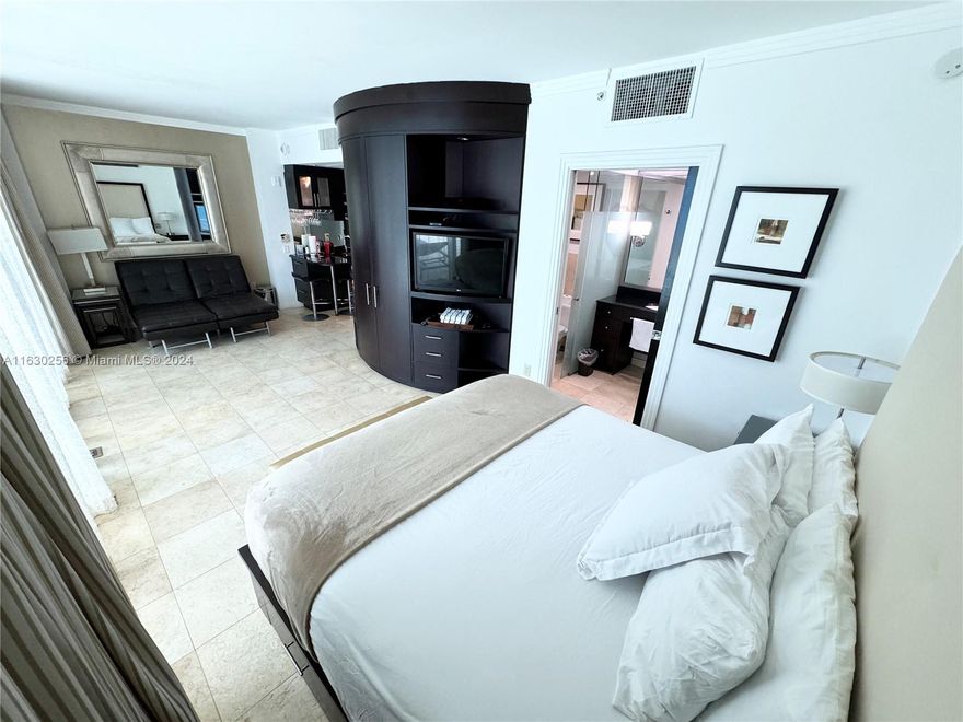 Welcome to our luxurious hotel condo unit in the heart of Miami Beach, where elegance meets convenience. Daily rentals allowed with an 8% cap rate! This exquisite property boasts direct access to a sparkling pool, allowing you to step out of your private retreat and dive into the refreshing waters in an instant. Situated in the best part of Miami Beach, the condo offers an unparalleled blend of comfort and style. The interior is thoughtfully designed with modern furnishings, high-end finishes and open-plan living area that features a sleek, fully-equipped kitchen, a cozy dining nook, and a spacious lounge perfect for relaxation. Step outside onto your private patio, where you can unwind with a morning coffee or an evening cocktail while enjoying the serene poolside ambiance.