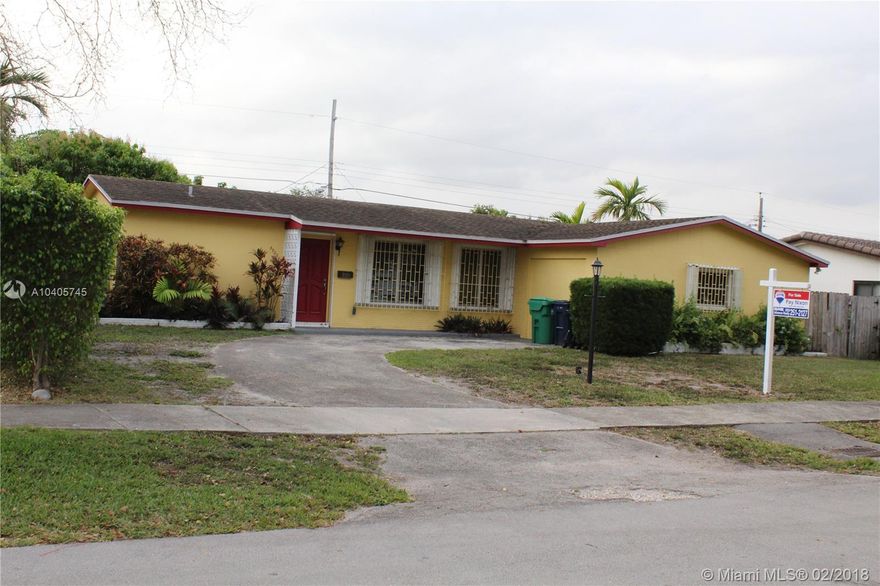 Spacious 4/3 home in a quiet, friendly and desirable neighborhood near shops, expressways. Solid 1960's construction and great closets space. Renovated kitchen with new appliances, fixtures etc. has ample counter space. New A/C unit, freshly painted throughout. Split bedroom plan with two master suites. Easy-clean terrazzo floors, ceiling fans and hurricane shutters throughout. Big 24x 15 screened & covered patio opens to a fenced yard. The garage was converted to a spare room/studio/workshop, or could be used as a 5th bedroom. Great location!