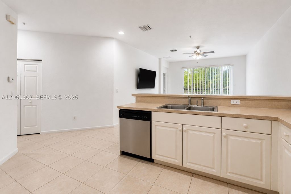 Photo of 1925 Marsh Harbor Dr #204, Riviera Beach, FL 33404 (MLS # A12061307)
