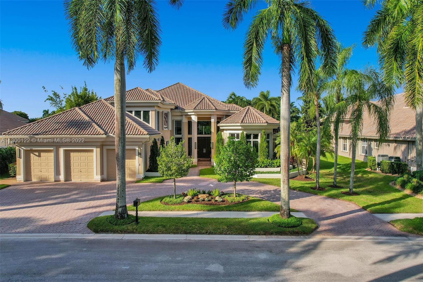 PRISTINE masterpiece located in the sought-after neighborhood of "Riviera" in the prestigious Weston Hills Country Club. Breathtaking WATER & GOLF views on over 1/2-acre lot. This meticulously maintained home features 5 Bedrms, 5 Baths, 2 Half baths PLUS office & a 2nd floor loft/bonus rm. Finest finishes & highest attention to detail combined with pure elegance & luxury w/5,768 sq. ft. under air (per original plans) entire interior renovated, custom high-end millwork & built-ins, soaring ceilings, floor to ceiling windows thru-out, master bedroom suite with spa like bath w/his & hers showers & water closets, gorgeous chef's kitchen w/center island & top of the line appliances. All together with an expansive covered patio with built-in grill, pool & spa, & impact glass/accordion shutters!
