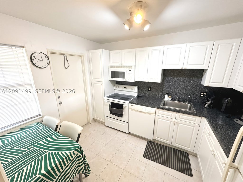 Photo of 2681 S Course Dr #511, Pompano Beach, FL 33069 (MLS # A12091499)