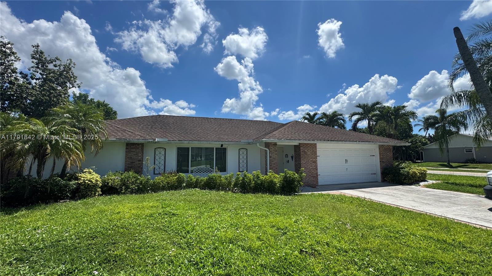 Motivated Seller/Investor Alert! Beautifully renovated 4-bedroom, 2-bath pool home with 2-car garage in the heart of Wellington. Updated kitchen features quartz countertops, stainless steel appliances, and gray wood cabinetry. Tile flooring throughout living areas, bamboo wood in the formal living room, and wood laminate in bedrooms. Both bathrooms have been tastefully updated with modern fixtures. Freshly painted inside and out. Relax in the screened-in porch overlooking a private pool. Located in a sought-after neighborhood minutes from top-rated schools, shopping, dining, the Polo Club, and world-class equestrian venues. Don’t miss this opportunity!