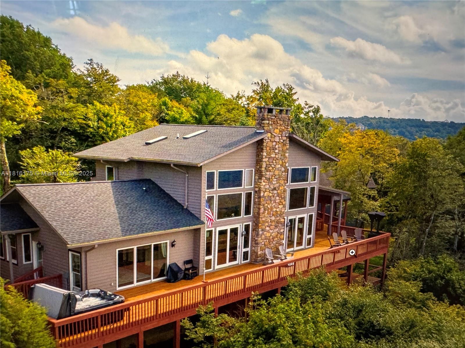 TWO HOMES located on 5 Acres: The Best Long Range Views. The Main House, "SKYTOP CHALET" 4 Bedrooms and 3 &1/2 Baths. Guest House added in 2014, "SUMMIT CHALET", 1 Bedroom, 1 Bath for a Total of 5 Bedrooms and 4 1/2 Baths. The property is situated at approximately 5000' elevation. Homes are connected by a Sky Bridge (Walkway). Close to all the Beech Mountain Amenities, A little over one mile to the Ski Resort. A Sports Membership to The Beech Mountain Club is included with your purchase, which includes World Class Golf, Tennis, 24 Hour Health Club, A Fabulous Dining Room overlooking the Golf Course, Miles of Marked Hiking Trails, Two Trout Stocked Lakes, The homes are being conveyed fully furnished.