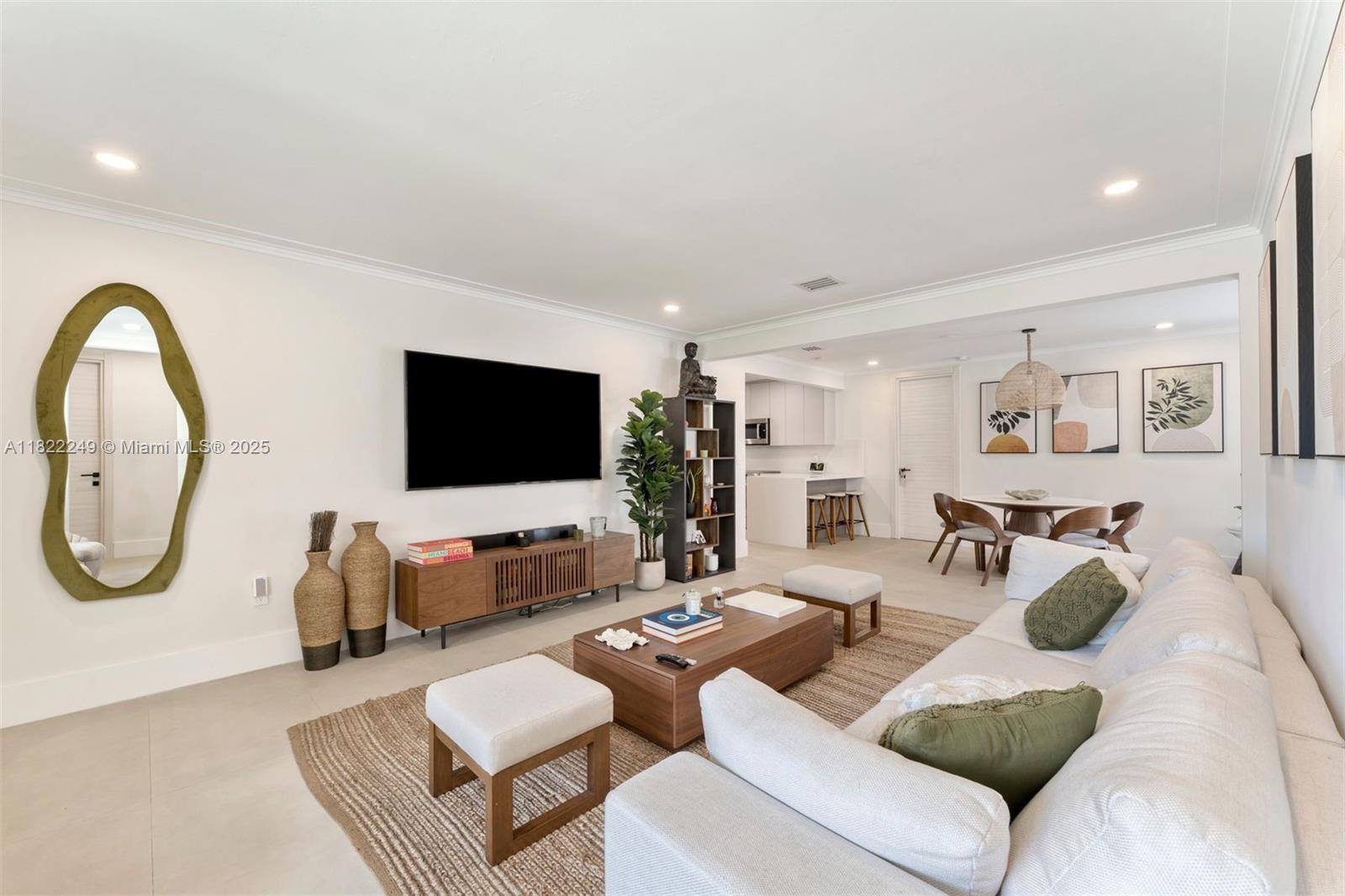 Fully furnished home in the heart of Coral Gables, a fully remodeled masterpiece blending modern sophistication with the timeless charm of its prestigious location. This exquisite 3-bedroom, 2-bath residence offers an unparalleled living experience, just steps from the vibrant Plaza and iconic shops at Miracle Mile and Merrick Park. Inside, you’re greeted by an open layout that exudes elegance and comfort, maximizing space and natural light. The bedrooms are well-sized, with the primary featuring an en-suite bath. Step outside to a secluded, cozy backyard — a private oasis of lush landscaping. A saltwater stock tank pool invites relaxation and summer enjoyment, perfect for outdoor gatherings or peaceful moments.