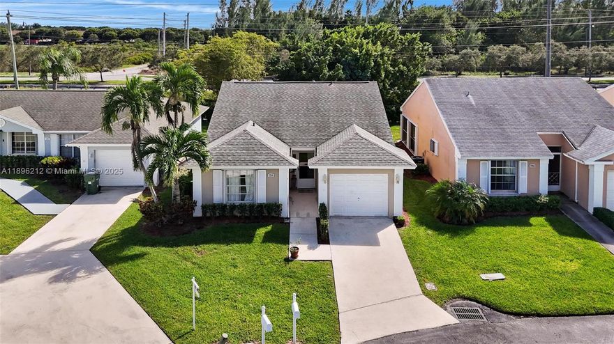 Beautifully updated 2BR/2BA free standing villa with 1-car garage in the gated community of North Gate at Keys Gate. Home has been re-plumbed and features a modern kitchen with Kraftmaid cabinets, stainless steel appliances, and open snack bar with storage drawers. Both bathrooms are updated, and waterproof laminate floors run throughout. Vaulted ceilings add spaciousness, while the original patio has been legally enclosed to create extra under-air living space. Backing to the canal, this home combines style, comfort, and a prime location in a secure community.  Easy to Show & Ready to Go!