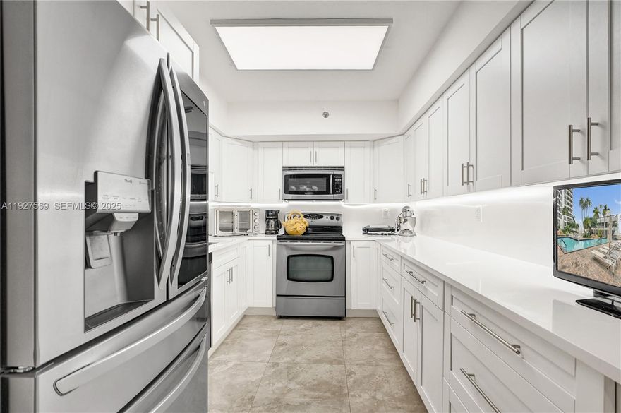 Great opportunity to own in the desirable Mystic Pointe community, Tower 300. This spacious 1,150 SF condo offers 2 BD / 2 BA, fully furnished, with a split floor plan. Enjoy a balcony overlooking lush garden views, creating a peaceful indoor-outdoor living experience.
The kitchen & second BA were fully renovated in January 2025. The primary BA was updated approximately five years ago & features both a tub & separate shower. New A/C system was installed in January 2025. Features stainless steel appliances, modern white cabinetry & quartz countertops & backsplash, porcelain flooring in living areas, washer & dryer, accordion shutters & a generous primary BD w/ a large walk-in closet and ensuite BA. One covered parking space & one storage unit. Mystic Pointe offers a true 5-star resort-style lifestyle with strong management, fully funded reserves, and has passed its 40-year inspection; no special assessments. Amenities include a heated pool, Jacuzzi, sauna, tennis & pickleball courts, fitness center, tot lot, dog park, 24/7 gated security, nail & hair salon, on-site restaurant and convenience store, EV charging stations, on-site shops, waterfront walking path. Boating enthusiasts will appreciate the on-site marina, with docks available to purchase or rent.
Located minutes from Aventura Mall, dining, beaches, the Brightline station, top-rated schools, Hard Rock Stadium, Gulfstream Park, and houses of worship. Aventura living at its best don’t miss this opportunity.