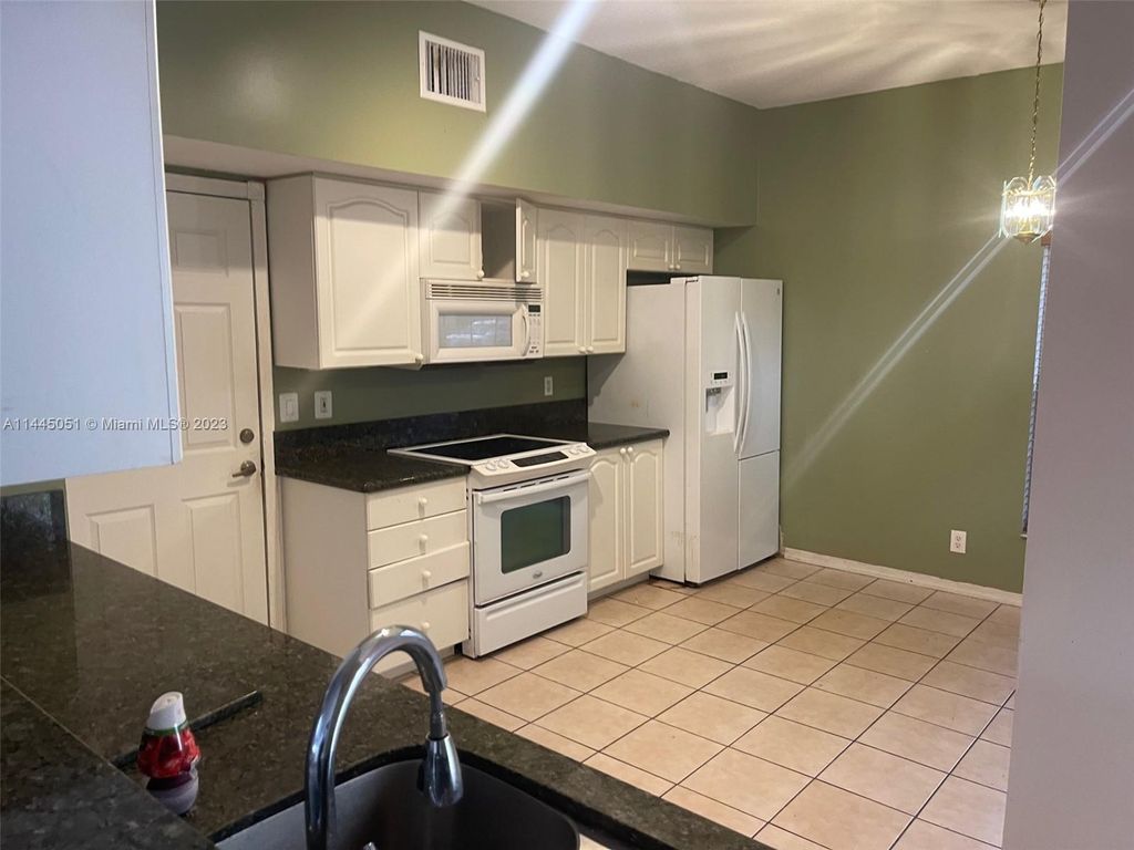 Photo of 8024 Via Hacienda, Riviera Beach, FL 33418 (MLS # A11445051)