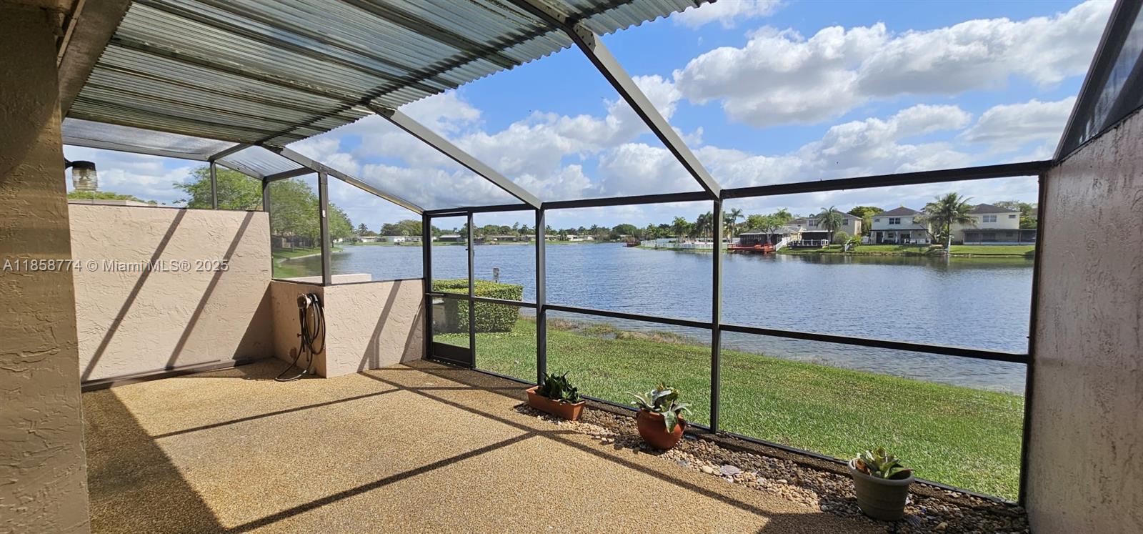 Introducing a tranquil 2-bedroom, 2-bathroom Waterfront Villa nestled in Pembroke Pines, boasting stunning canal views. Inside, discover the REMODELED kitchen, quartz counters with ample storage. 2 spacious bedrooms, generous closets and a dedicated laundry room equipped with a washer and dryer. Hurricane protection installed on all windows ensures your peace of mind during stormy weather. This prestigious 24/7 GUARD-GATED COMMUNITY offers an array of premium amenities including a pool, tennis courts, gym, sauna, and more. Step onto your private front or back patio and immerse yourself in the serenity of the surrounding canals. With 2 parking spaces conveniently located in front of the unit, along with ample visitor parking, convenience is at your doorstep. FAST APPROVAL! NO HOA APPROVAL