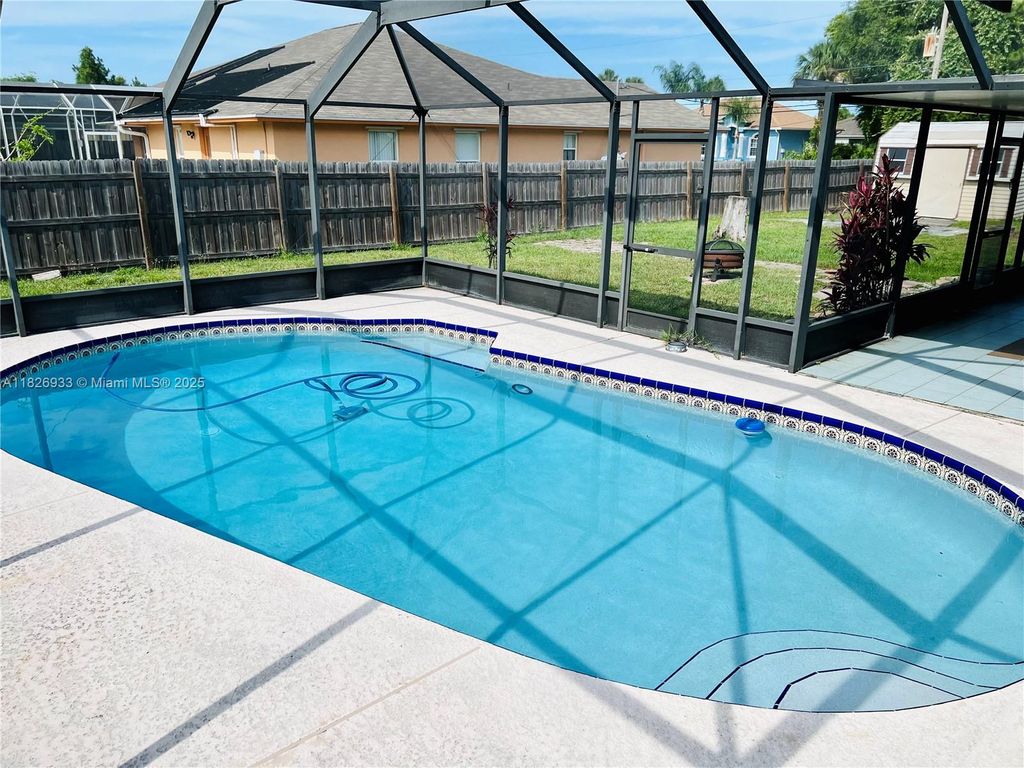 Photo of 1573 SW Lexington Dr, Port St Lucie, FL 34953 (MLS # A11826933)