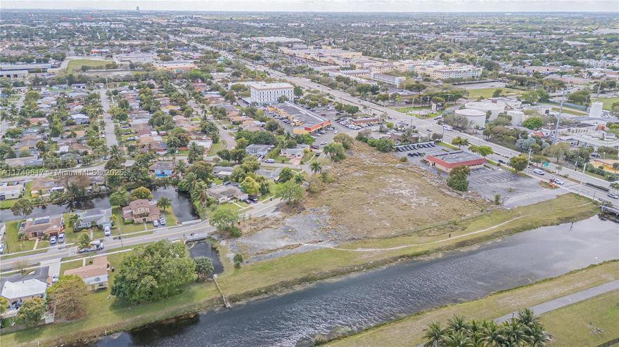 Rare Waterfront Commercial Lot – Prime Development Opportunity! Seize this exceptional 2.73-acre (118,759 sq. ft.) commercial lot, zoned B-2, offering versatile development potential for office, service, retail use, and other various uses. The subject is Multifamily Land proposed for 136 units. There are plans for three, five-story buildings with 244 parking spaces and an average unit size of 887 square feet. Includes 32 split-level units and 104 single story units, many of which include balconies. The plans also call for amenities including a common plaza, splash pad, playground, and a dog park. Last appraisal was done in September 2022 for $5.3M. Buyer is responsible for their own DD. Drive by and call Listing agent for more details. Will not last!