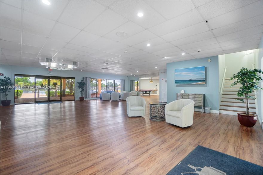 Gorgeous lakefront 2BR/2BA corner condo, totally remodeled and ideally located near the community clubhouse. This bright and spacious unit features extensive upgrades throughout, including top-of-the-line finishes, accessories, and appliances. Enjoy serene lake views and abundant natural light from this prime corner location. Situated in the heart of Hollywood within the highly desirable Carriage Hills community, offering resort-style amenities such as a stunning clubhouse, pool, fitness center, tennis courts, walking trails, and more. Centrally located close to shopping, dining, entertainment, major highways, and houses of worship. A true move-in-ready gem—close to everything!